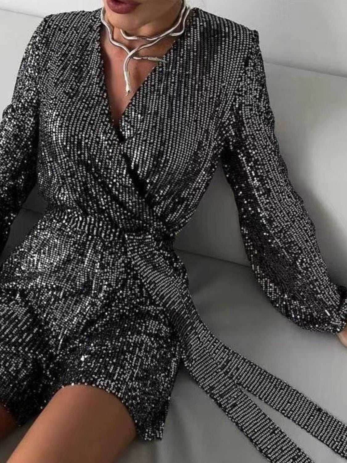 Full Size Sequin Surplice Tie Waist Long Sleeve Romper | Sugarz Chique Boutique