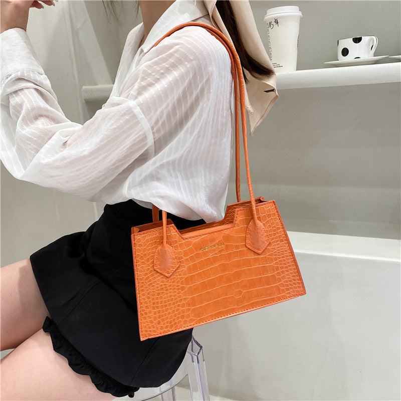 Orange Trendy portable handbag with structured square shape and top handle
