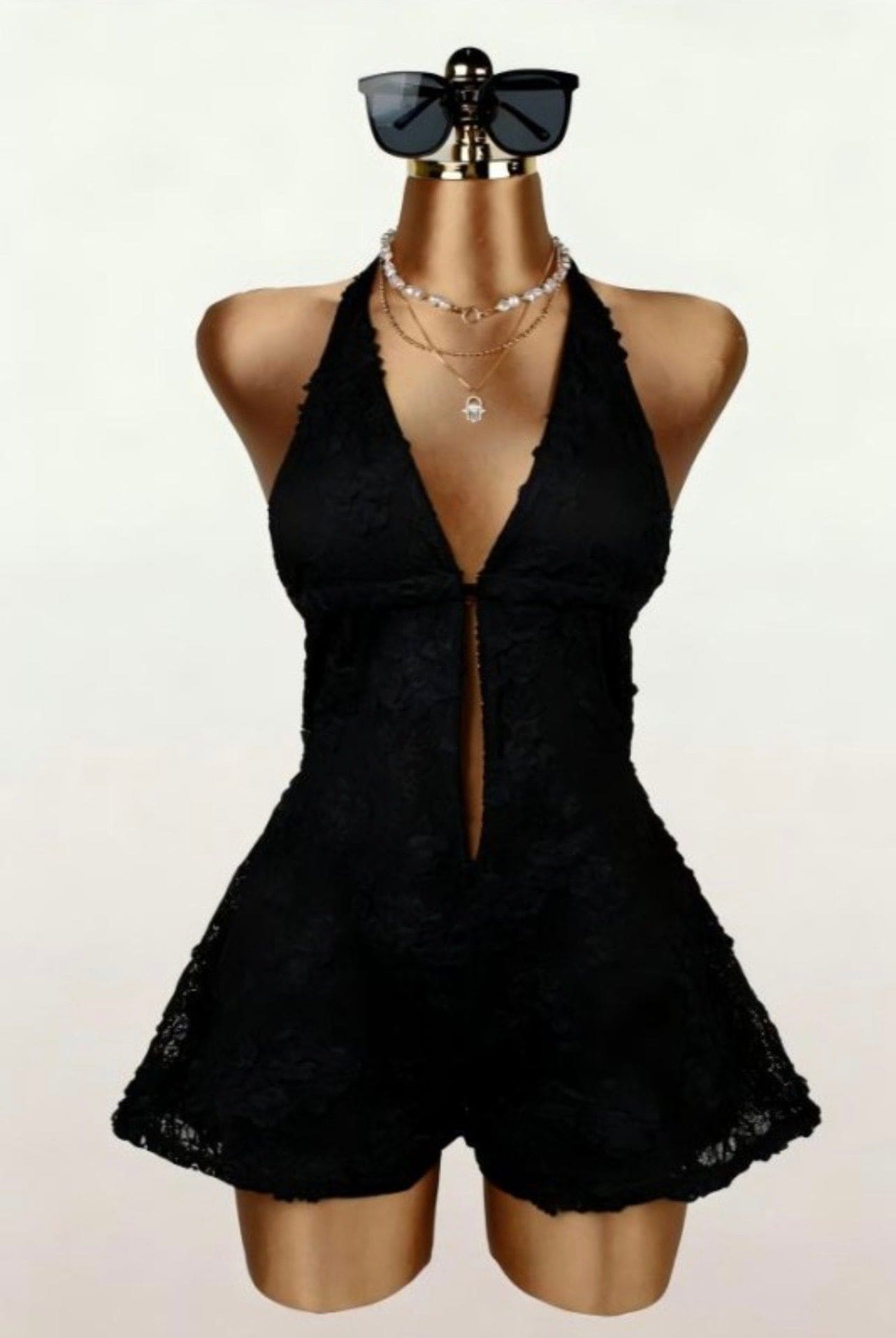Floral lace halter romper from Sugarz Chique Boutique featuring intricate lace details and a stylish halter neckline.