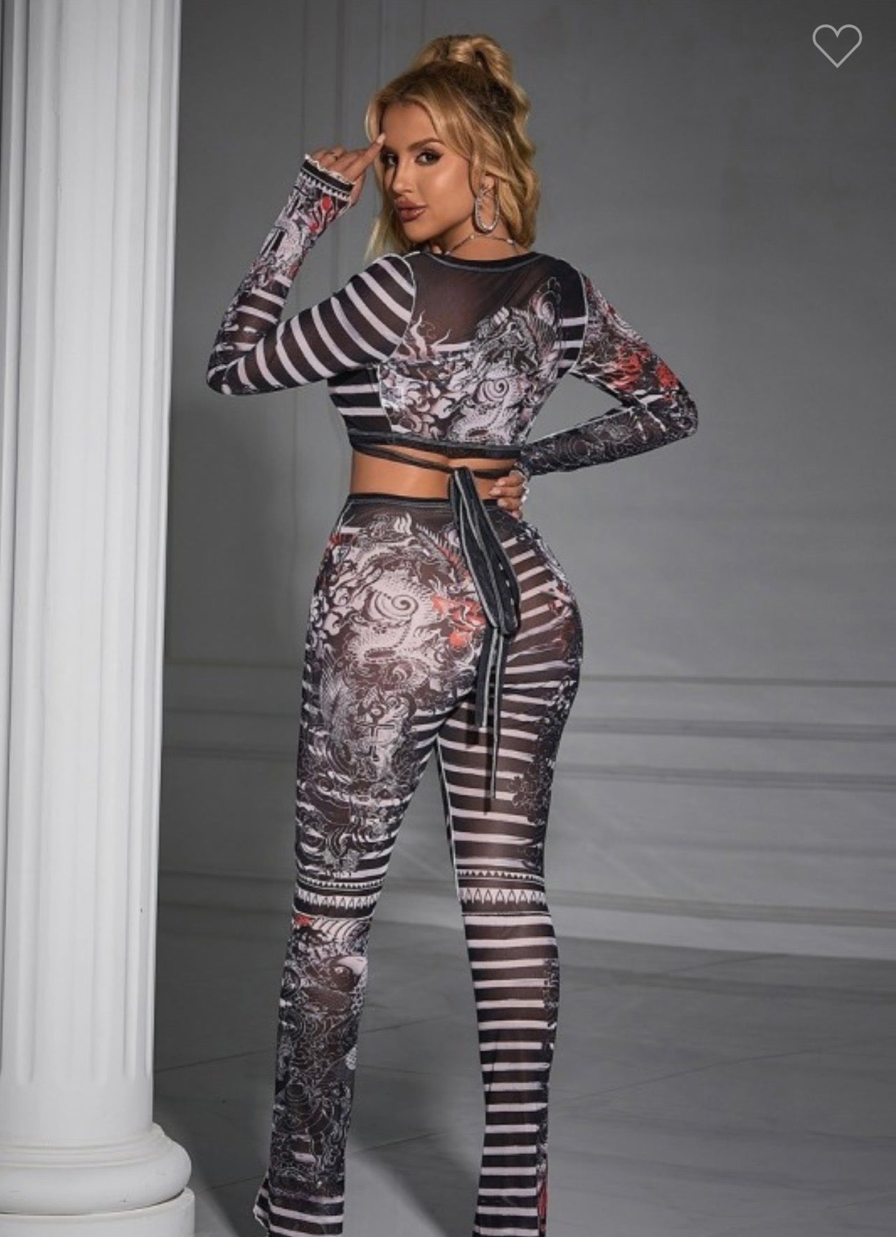 Mesh printed pant set from Sugarz Chique Boutique featuring a stylish, comfortable matching top and pants in a modern design.