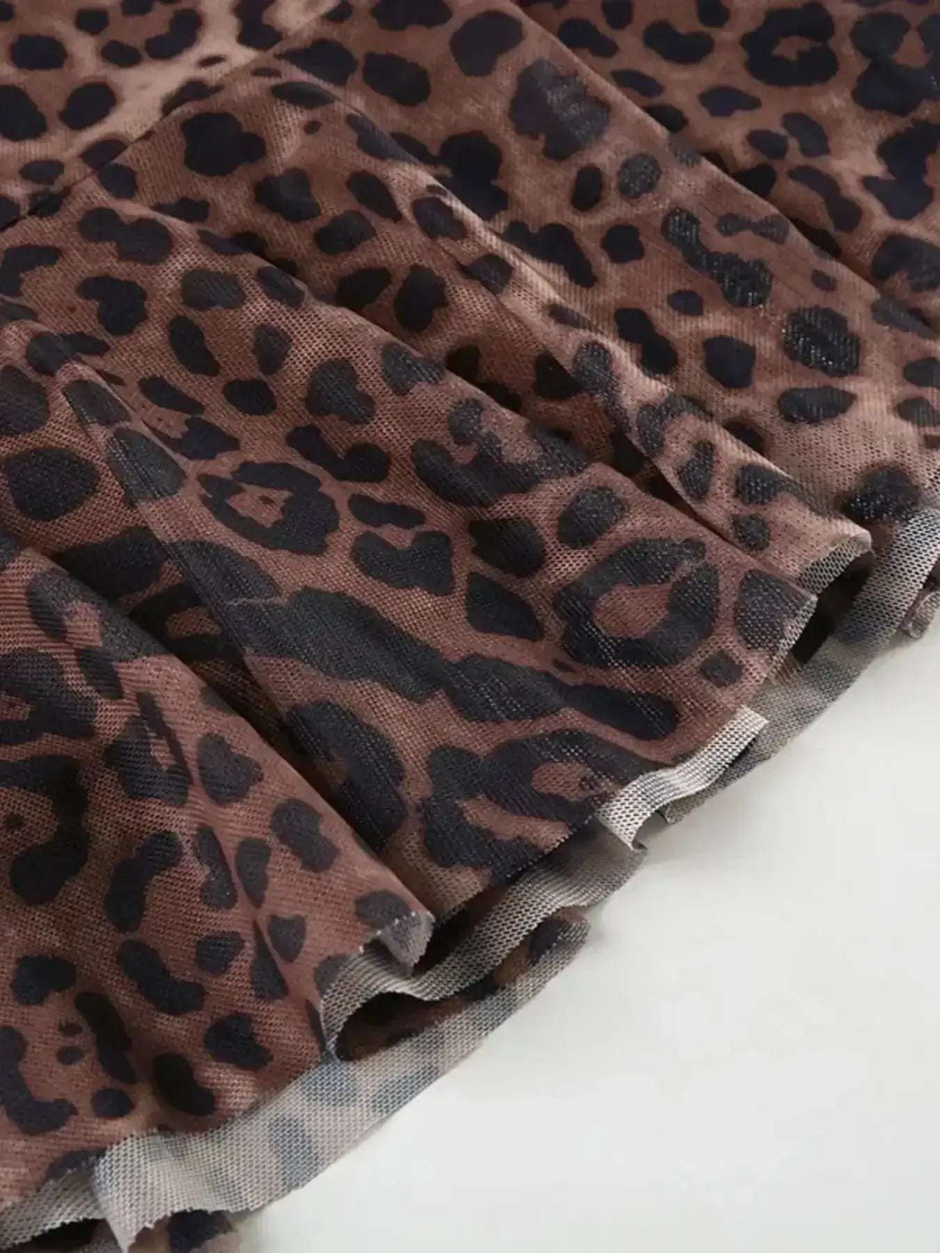 Leopard Print V-Neck Ruffle Hem Mini Dress | Sugarz Chique Boutique