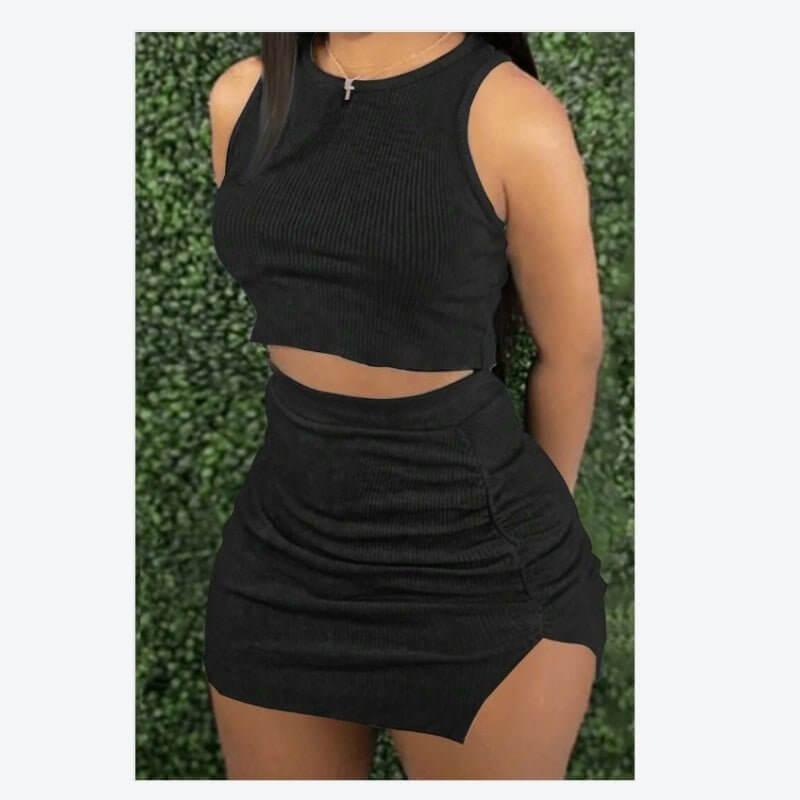 Ladies' ribbed crop top and bodycon skirt set in black, made from polyester and elastane, perfect for casual styling.