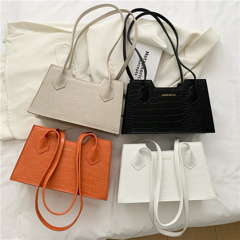 Mini square purse with adjustable strap and fashion-forward details