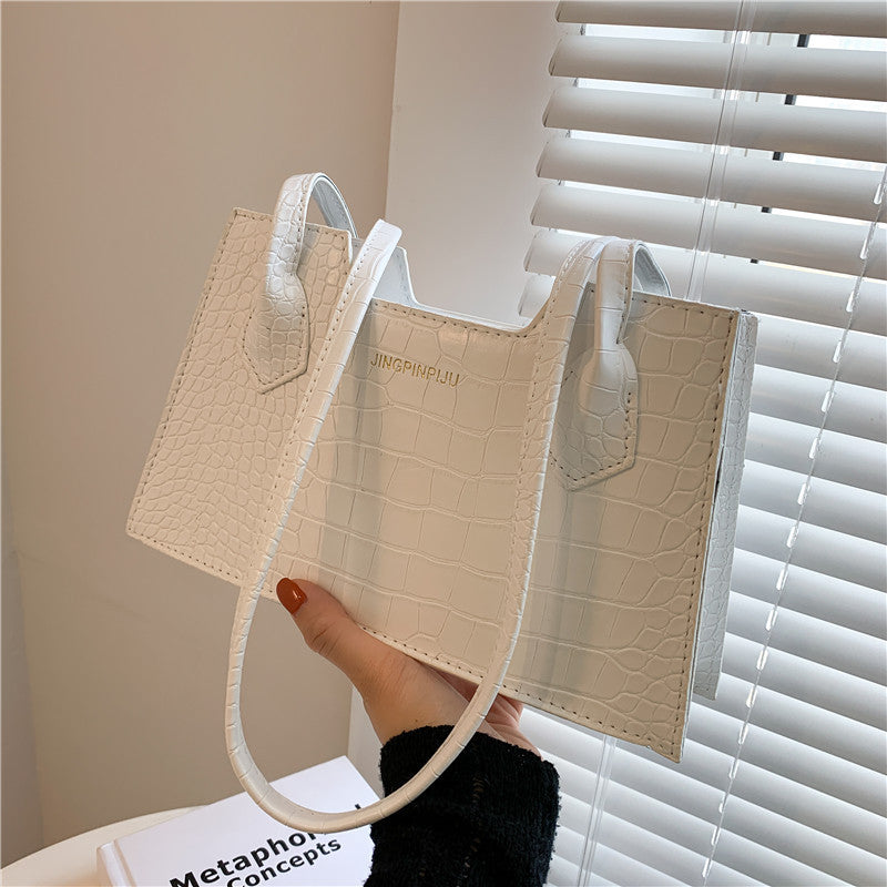 Cute small structured handbag for spring and summer fashion trends