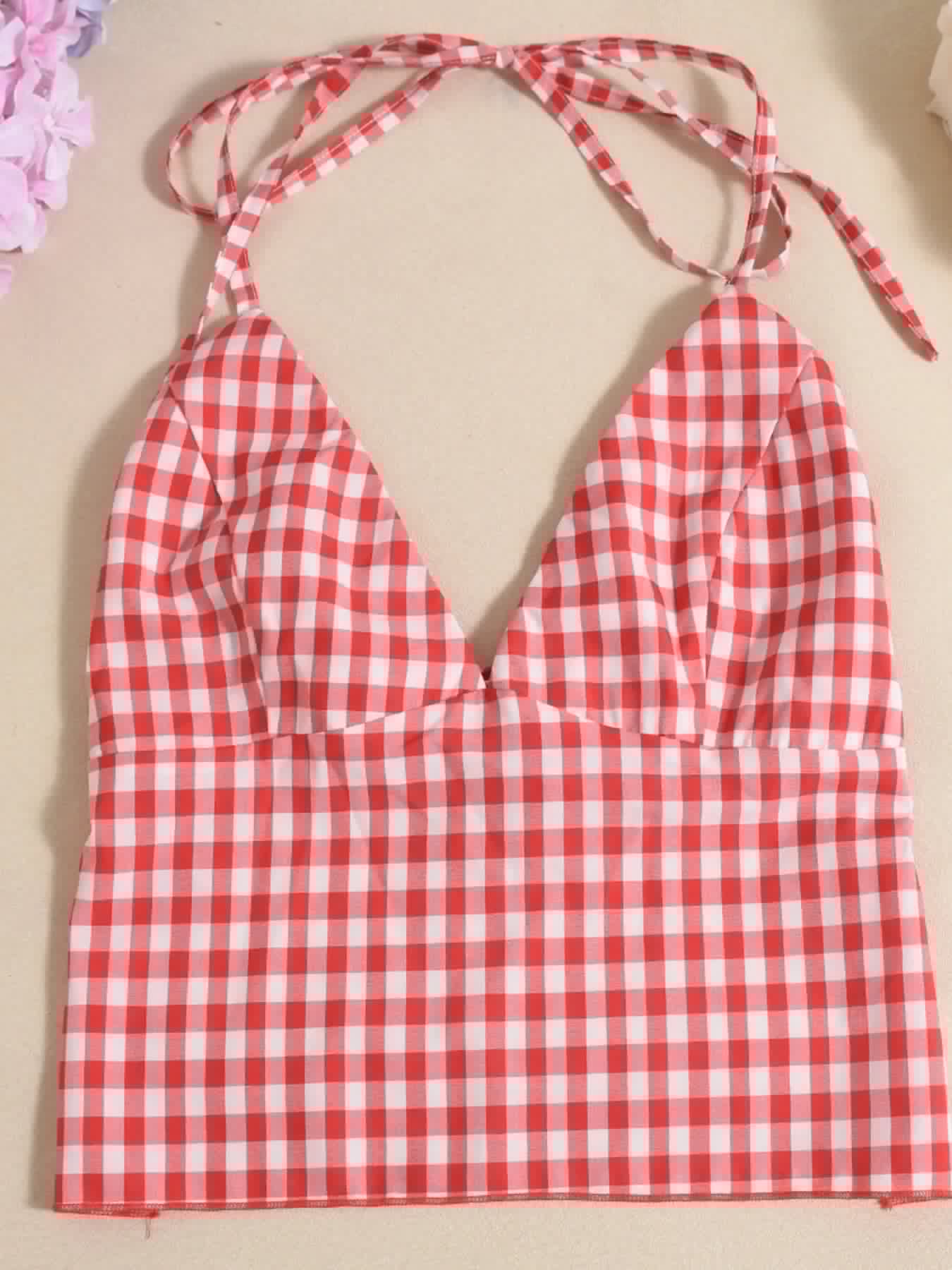 Red and white plaid halter neck cami top with tie straps and a deep V neckline.