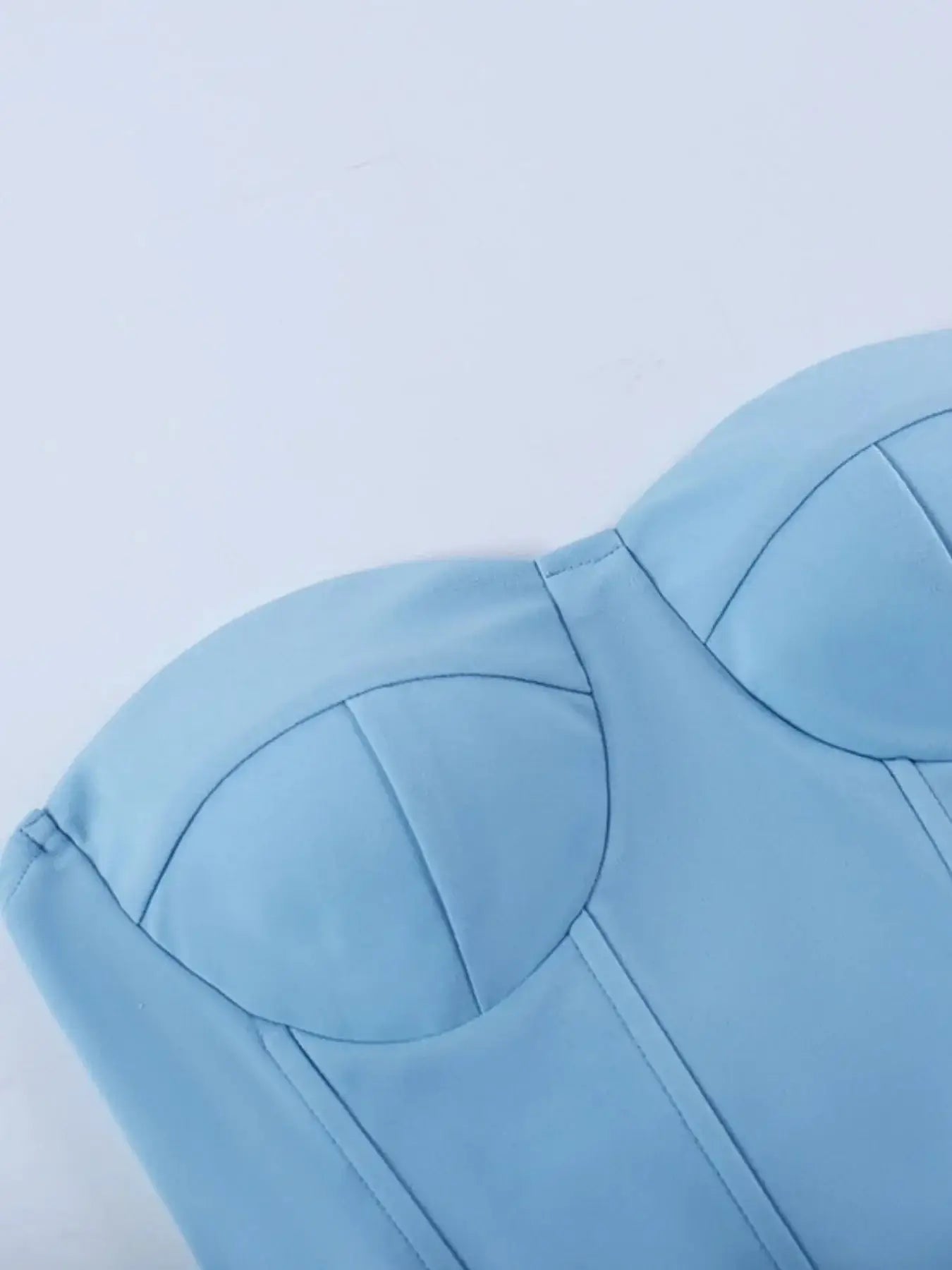 Light blue sweetheart neck tube top featuring a structured design and stitching details, perfect for stylish summer outfits.