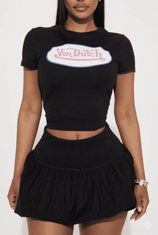 Bright graphic tee from Sugarz Chique Boutique featuring bold, colorful design on soft cotton fabric.