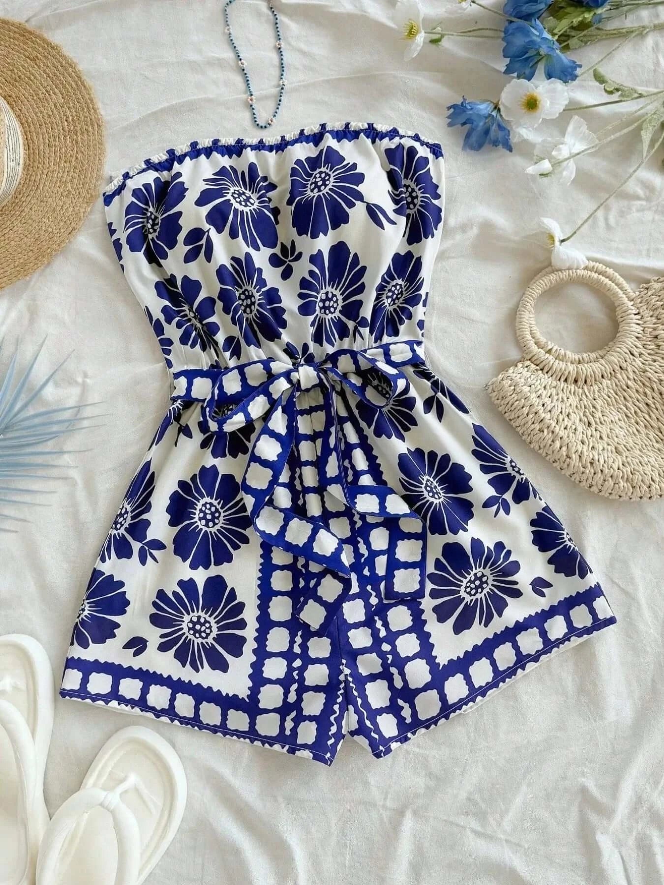 Printed tube tie waist romper in floral design with belt on a light background, perfect for summer wear.