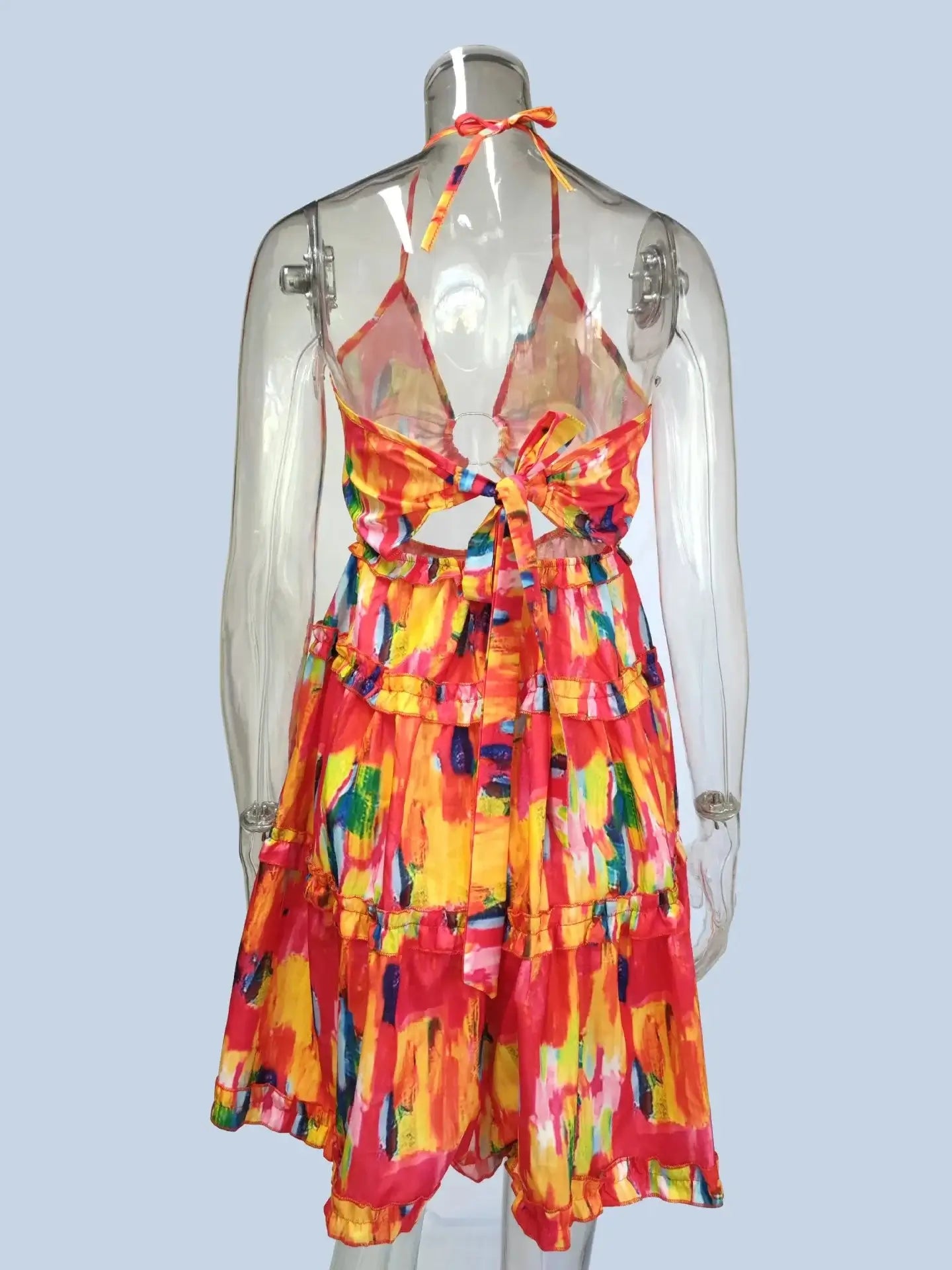 Bright multicolored full size cutout halter neck cami dress with ruffles and tiered design.