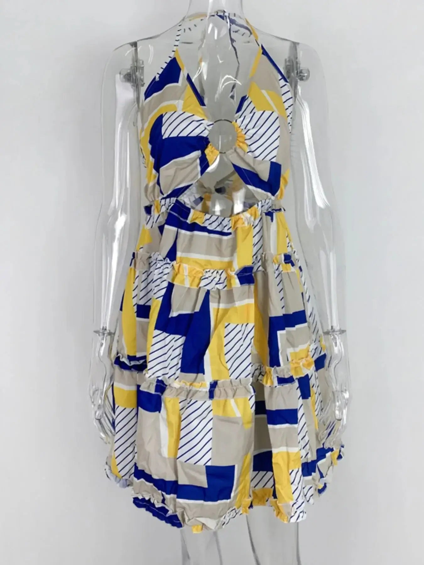 Full size cutout halter neck cami dress in yellow, blue, and beige geometric print with ruffled tiers.