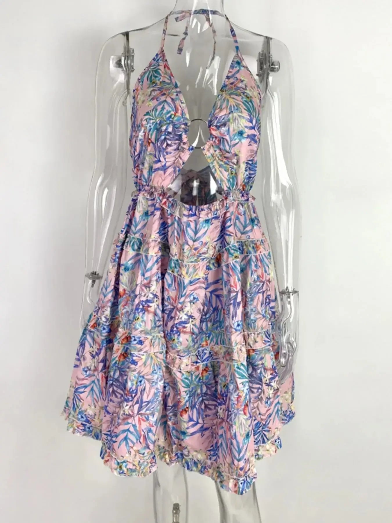 Full size halter neck cami dress featuring a colorful floral print and tiered ruffled design.
