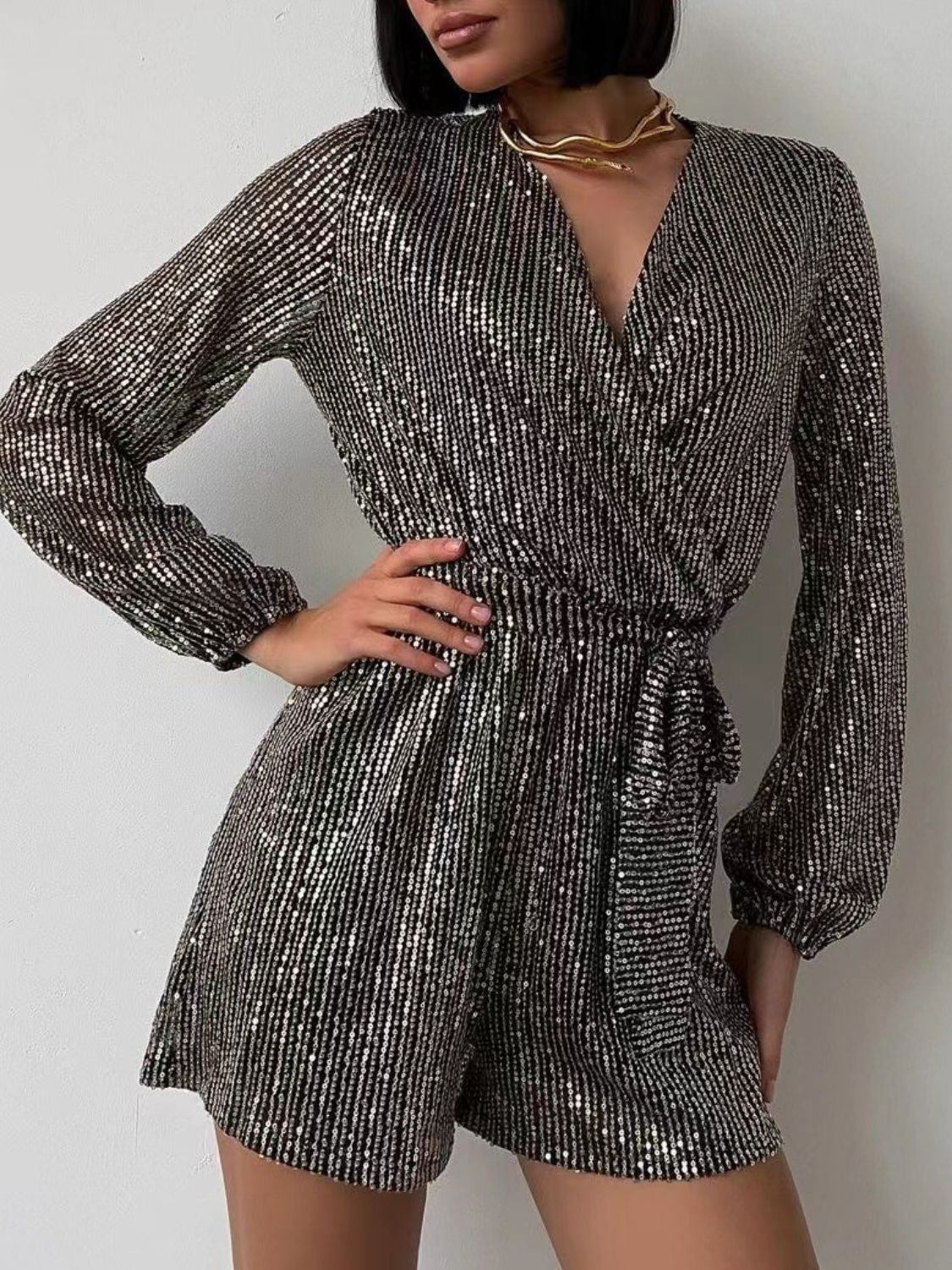 Full Size Sequin Surplice Tie Waist Long Sleeve Romper | Sugarz Chique Boutique