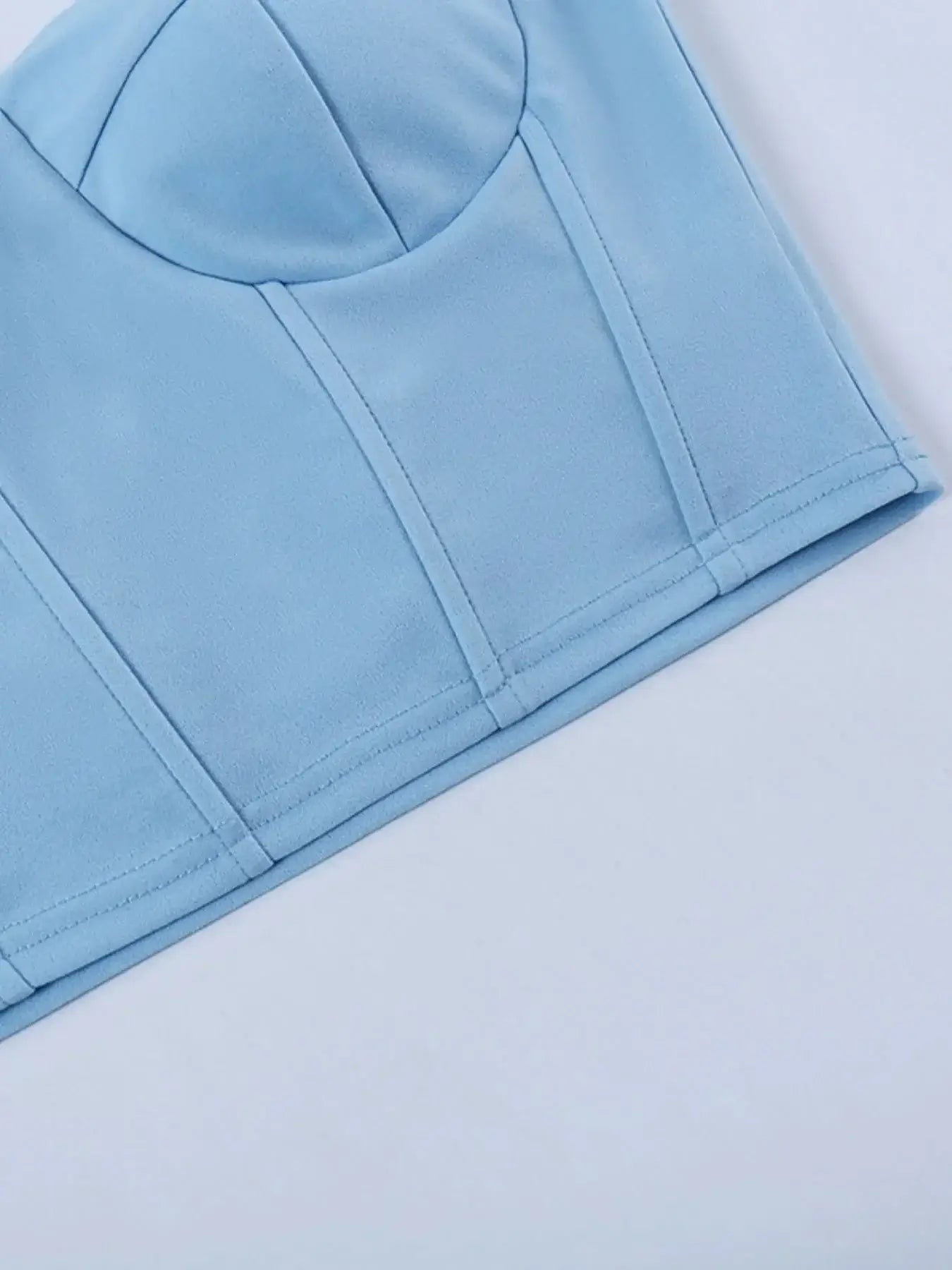 Light blue sweetheart neck tube top with seam details, crafted from stretchy polyester and spandex blend.