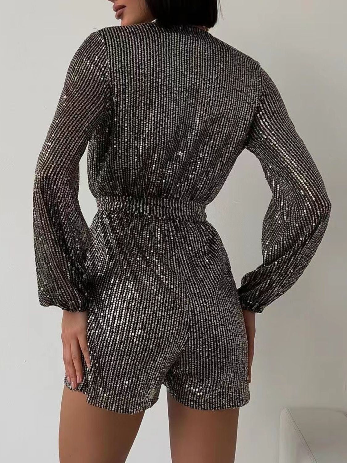 Full Size Sequin Surplice Tie Waist Long Sleeve Romper | Sugarz Chique Boutique