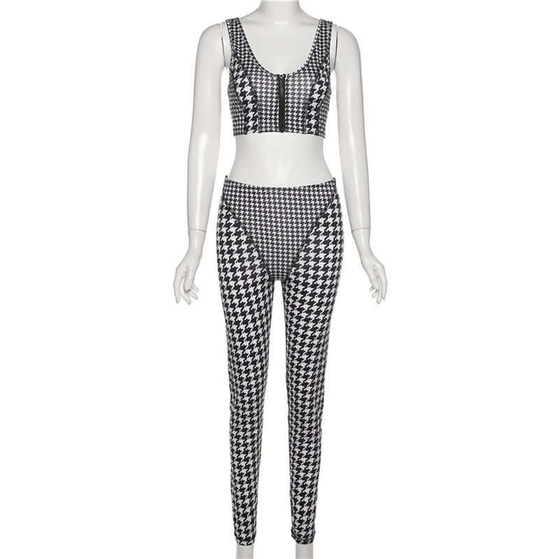 Women's black and white houndstooth print crop top and leggings set, stylish and comfortable attire.