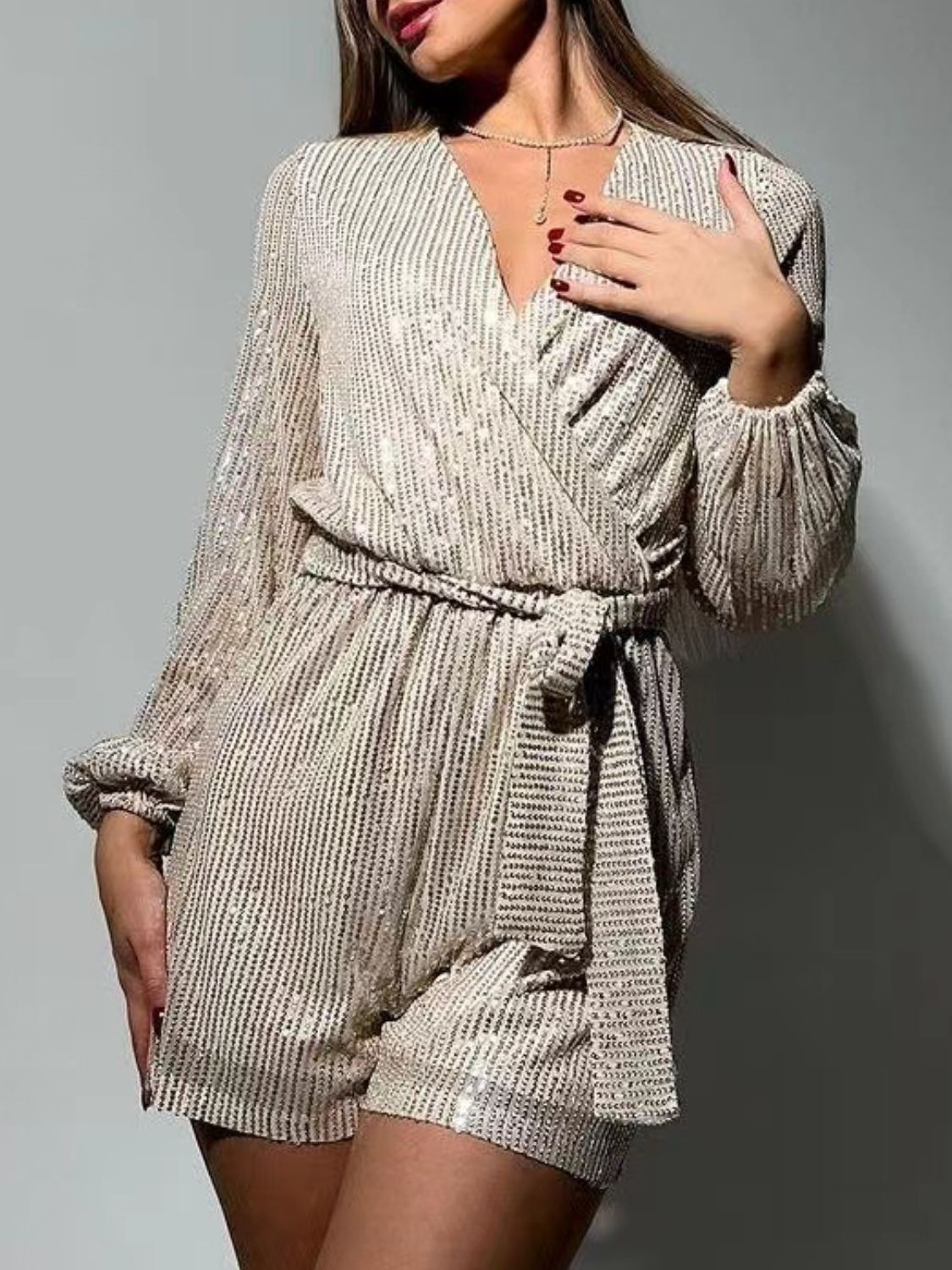 Full Size Sequin Surplice Tie Waist Long Sleeve Romper | Sugarz Chique Boutique