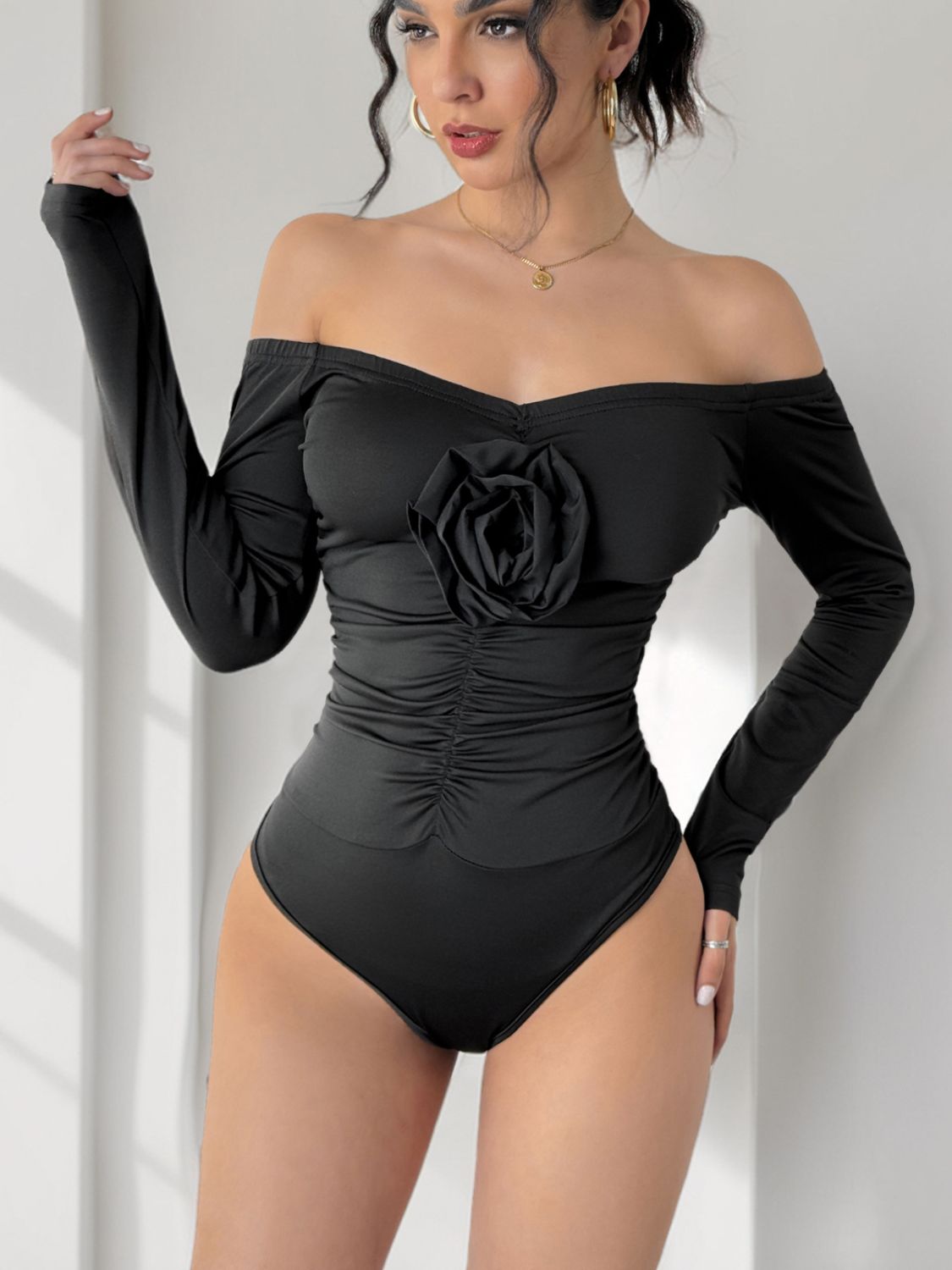 Perfee Ruched Flower Off-Shoulder Long Sleeve Bodysuit | Sugarz Chique Boutique