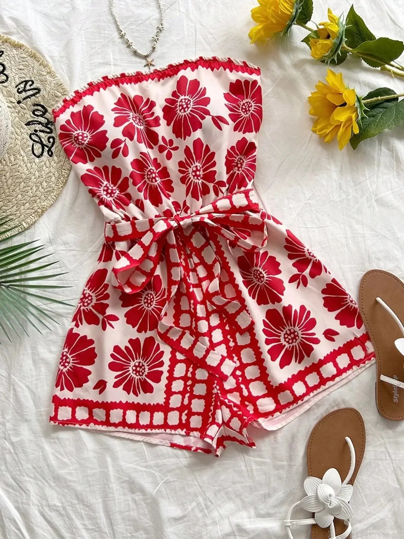 Printed tube tie waist romper with floral pattern, perfect for summer outings and casual wear.